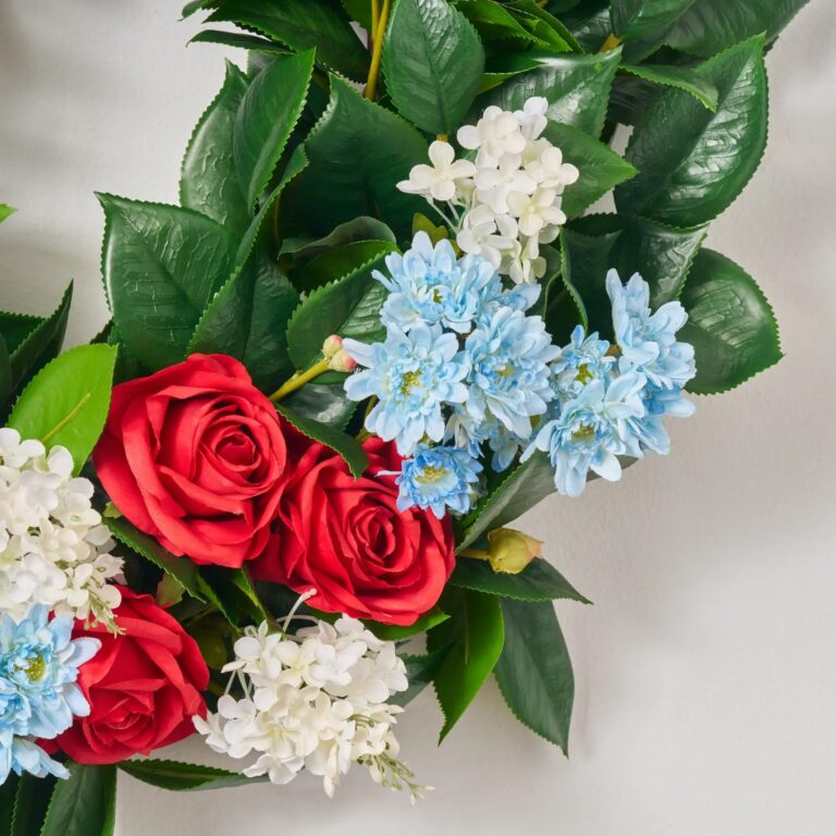Close-up of blooms and berries on this Miss Americana - Red Rose, Door Summer Wreath