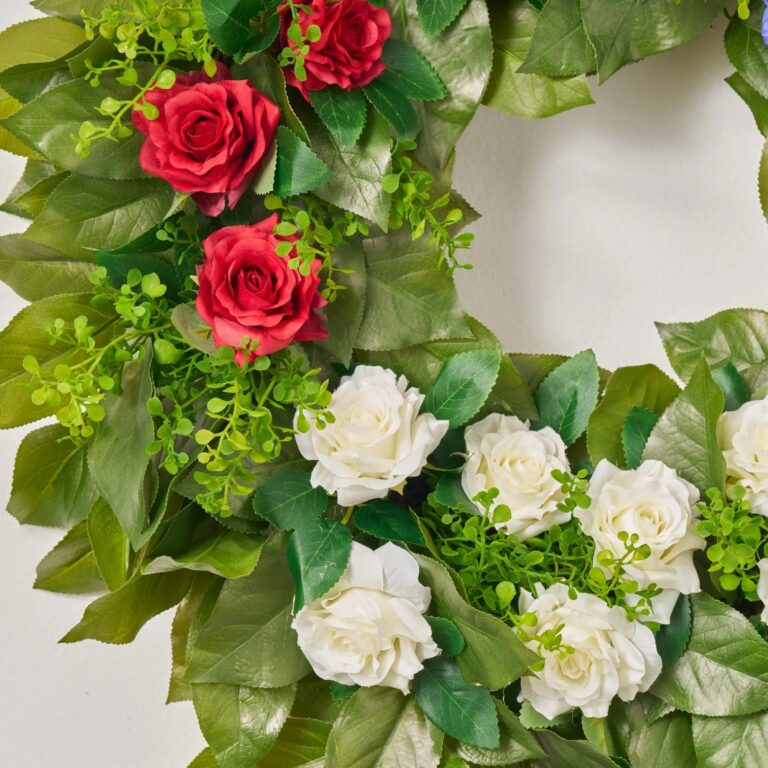 Close-up of blooms and berries on this American Beauty Blooms - Red, Front Door Wreath