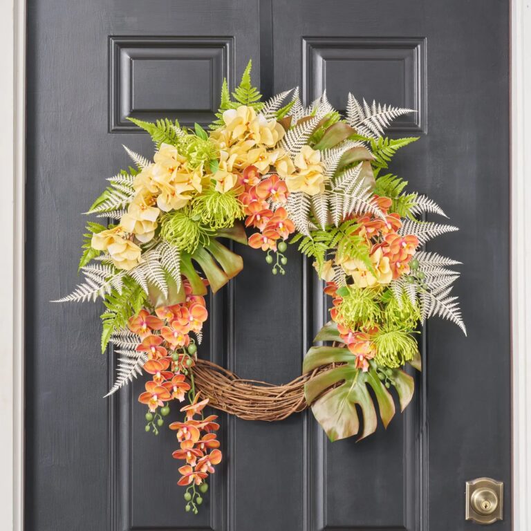 Close-up of blooms and berries on this Fern and Flora Fantasy Front Door Wreath