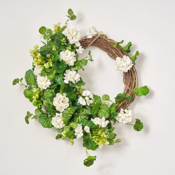 Close-up of blooms and berries on this White Hanging Geranium with French Front Door Wreath