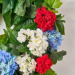 Close-up of blooms and berries on this Independence Bouquet - Red Geranium, Front Door Wreath