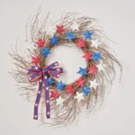 Close-up of blooms and berries on this Red, White and Blue Star Bow