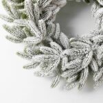 Alternate angle of the Snowy Flocked Winter Pine Christmas Christmas Holiday Wreath showing wreath face