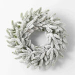 Close-up of blooms and berries on this Snowy Flocked Winter Pine Christmas Christmas Holiday Wreath