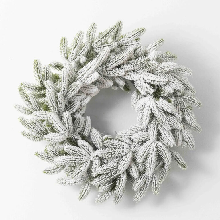 Close-up of blooms and berries on this Snowy Flocked Winter Pine Christmas Christmas Holiday Wreath