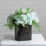 Close-up detail capturing leaf foliage texture of the Soft Blue Hydrangea and Mixed Tin Window