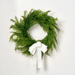 Close-up of blooms and berries on this Real Touch Lebanon Cedar Outdoor 6 Holiday Bow