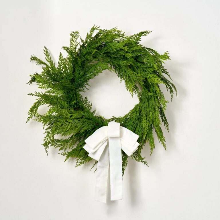 Close-up of blooms and berries on this Real Touch Lebanon Cedar Outdoor 6 Holiday Bow