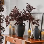 Close-up of leaf foliage texture on this Textured Black Terracotta Jug Vase with Handles