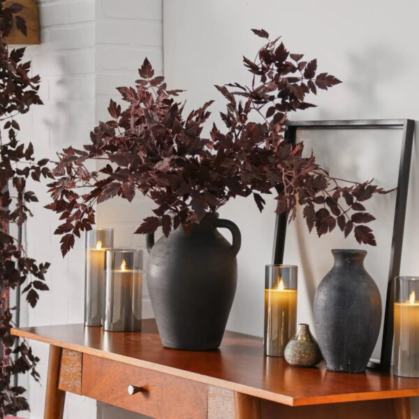 Close-up of leaf foliage texture on this Textured Black Terracotta Jug Vase with Handles
