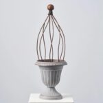 Close-up of vase silhouette detail on this Faux Stone Pedestal Outdoor Urn Pedestal Outdoor Urn