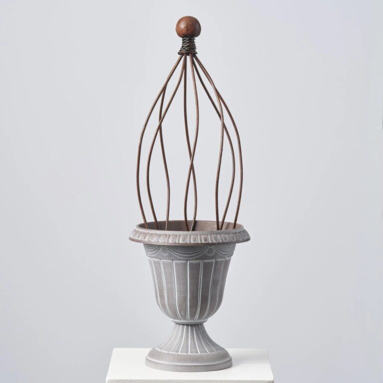 Close-up of vase silhouette detail on this Faux Stone Pedestal Outdoor Urn Pedestal Outdoor Urn