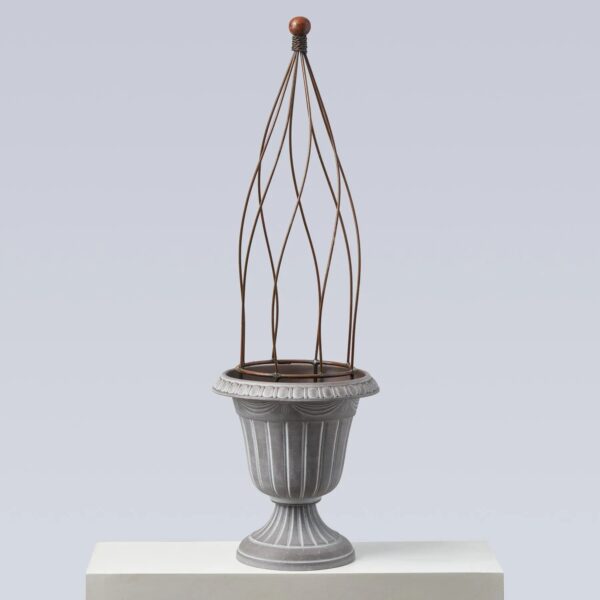 Close-up of vase silhouette detail on this Large Faux Stone Pedestal Outdoor Pedestal Outdoor Urn
