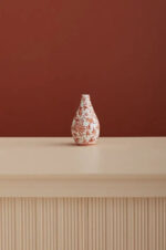 Alternate angle of the Coral Orange and White Hand Painted Chinoiserie Ceramic showing full plant