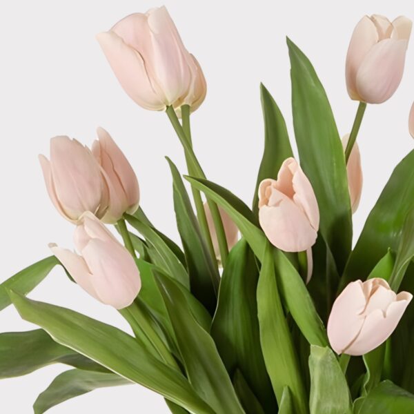 Close-up of vase silhouette detail on this Pink Artificial Tulip Arrangement Footed Glass Vase