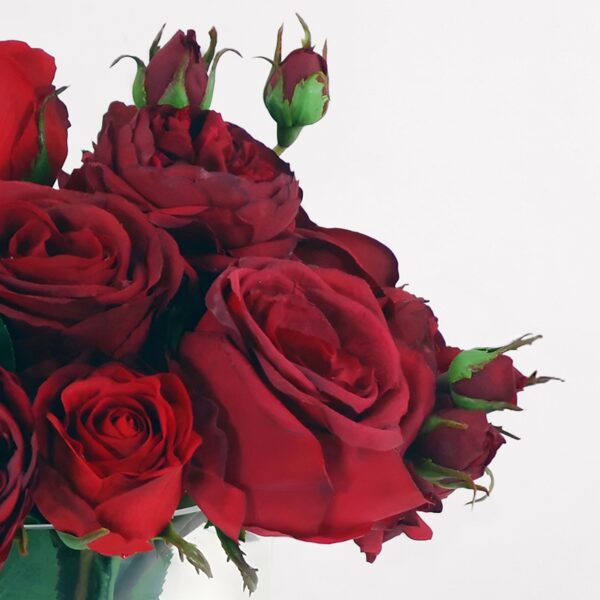 Close-up of vase silhouette detail on this Faux Arrangement of Red Roses Glass Vase