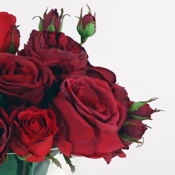 Close-up of vase silhouette detail on this Faux Arrangement of Red Roses Glass Vase
