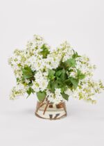 Close-up of vase silhouette detail on this Faux Lilac Flower Arrangement Glass Vase - 16