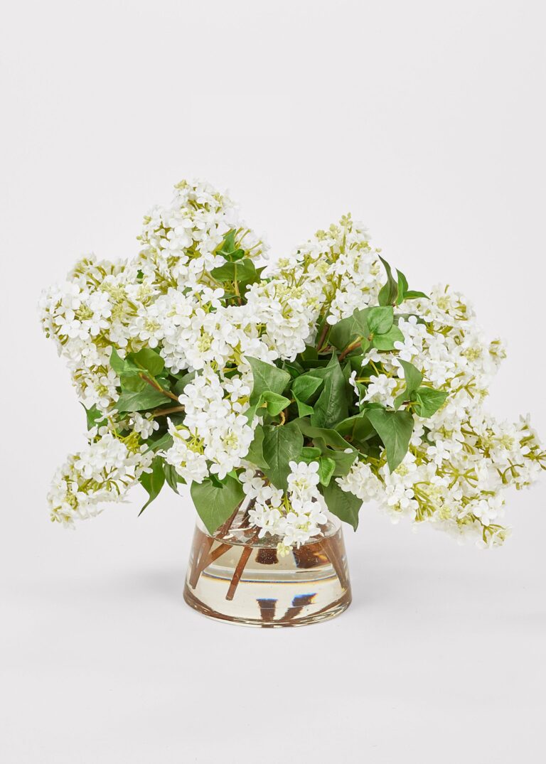 Close-up of vase silhouette detail on this Faux Lilac Flower Arrangement Glass Vase - 16