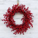 Close-up of blooms and berries on this Waterproof Red Berry Front Door Front Door Wreath