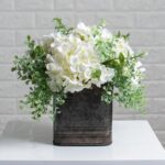 Detail view of planter detail from the White Hydrangea and Mixed Eucalyptus Tin Window Planter