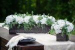 Side view of the White Hydrangea and Mixed Eucalyptus Tin Window Planter revealing frond and