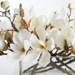 Alternate angle of the White Magnolia Blossom Branch Centerpiece Oval Pocket Vase showing bloom arrangement