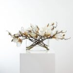 Close-up of vase silhouette detail on this White Magnolia Blossom Branch Centerpiece Oval Pocket Vase
