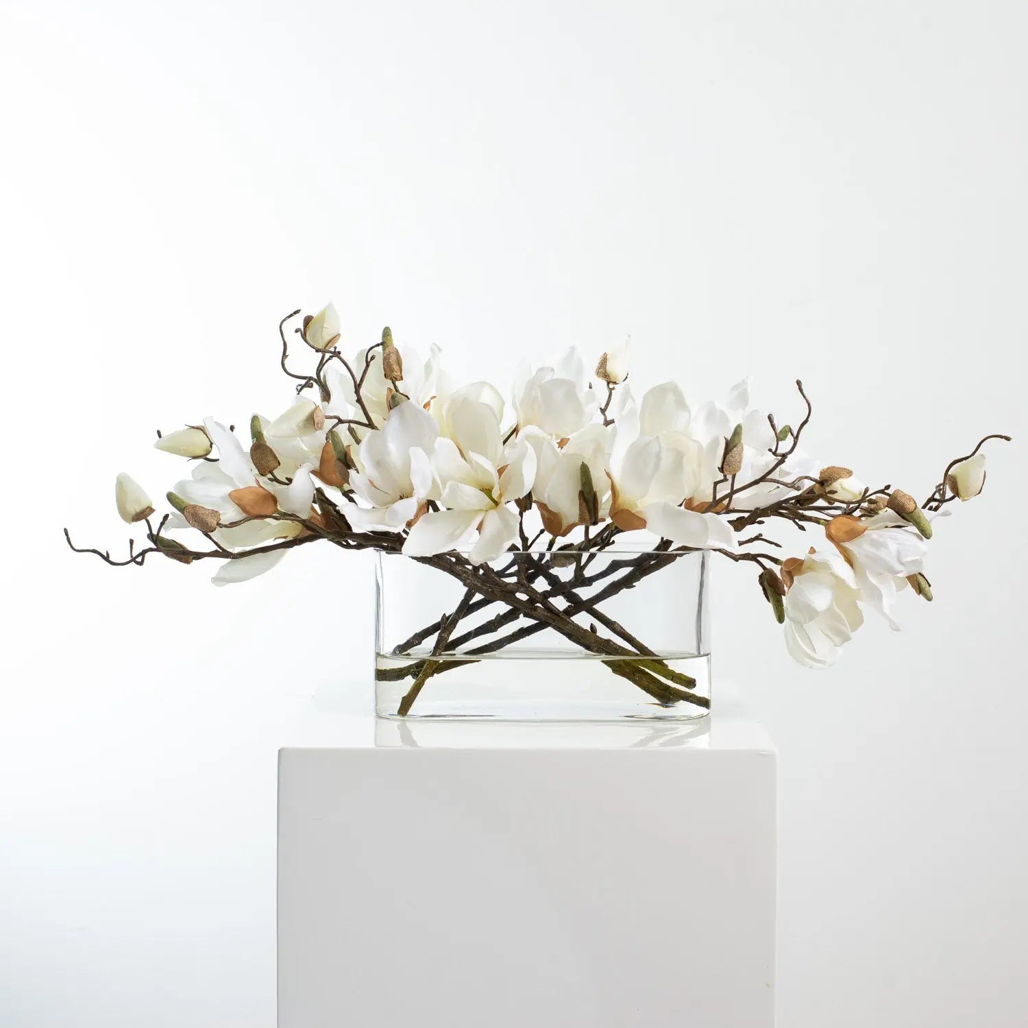 WhiteMagnoliaBlossomBranchCenterpieceWaterIllusionArrangementinOvalPocketVaseFAR11284.jpg White Magnolia Blossom Branch Centerpiece Water Illusion Arrangement in Oval Pocket Vase