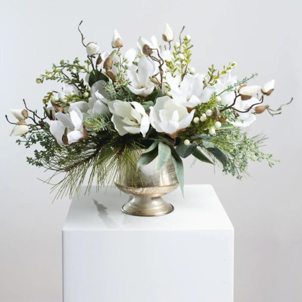 Winter White Magnolia, Pine and Snowberry Christmas Arrangement Centerpiece in Antiqued Silver Metal Urn