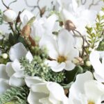 The Winter White Magnolia, Pine Silver Metal Urn shown in full, highlighting bloom cluster detail
