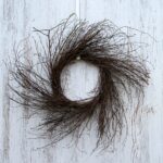 Close-up of blooms and berries on this Wispy Natural Birch Twig Everyday Wreath Base