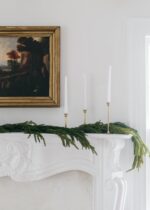 Close-up of greenery along the garland on this SAVE - Real Touch Norfolk Pine
