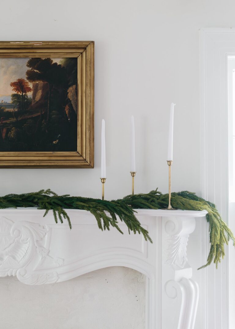 Close-up of greenery along the garland on this SAVE - Real Touch Norfolk Pine