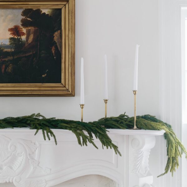 Close-up of greenery along the garland on this SAVE - Real Touch Norfolk Pine