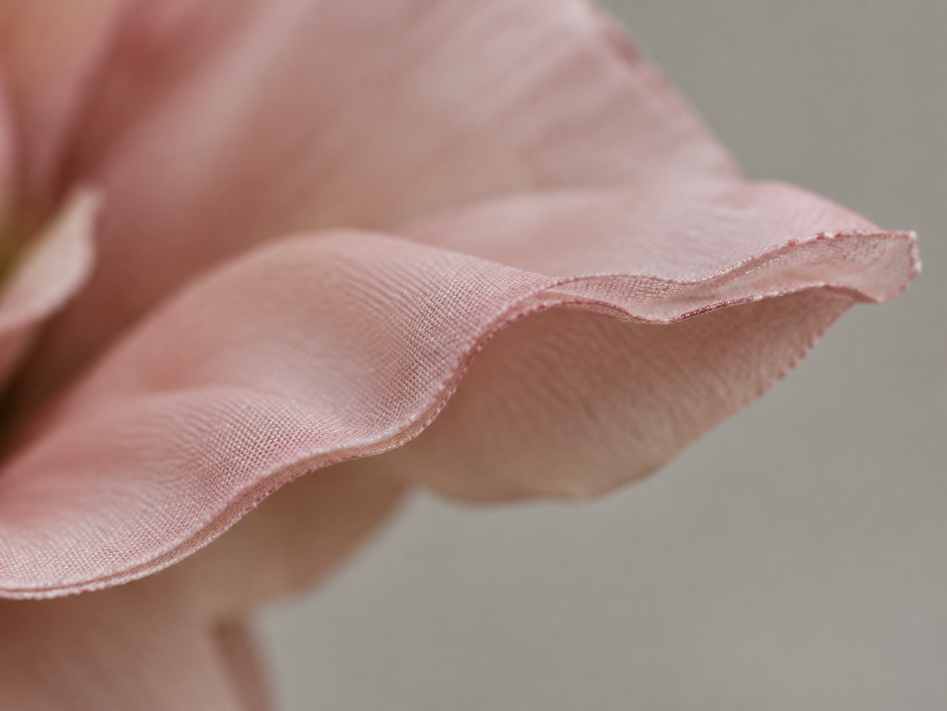 Close-up of a real-touch flower petal edge showing layered material and slight ruffle