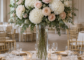 Tall artificial flower centerpiece with hydrangeas and roses on a round wedding reception table