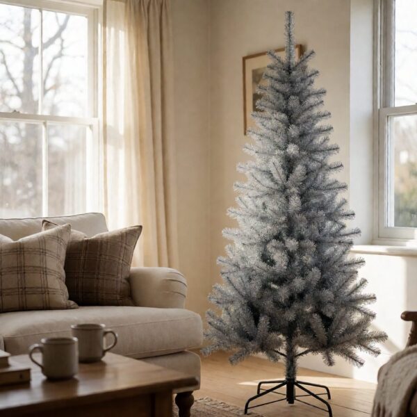 Silverado Slim Artificial Christmas Tree - styled next to a sofa in a bright living room, styled lifestyle scene